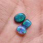 Assorted selection of Crystal and Black opals with vivid blue-green color play and full faced color