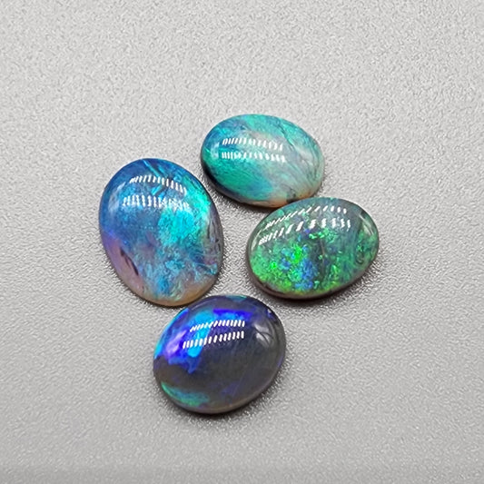 Assorted Dark opals/Black Opals with blue-green color play and mixed patterns