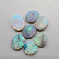 Assorted  Crystal opals  with a minty green color pallet and mossy patterns.