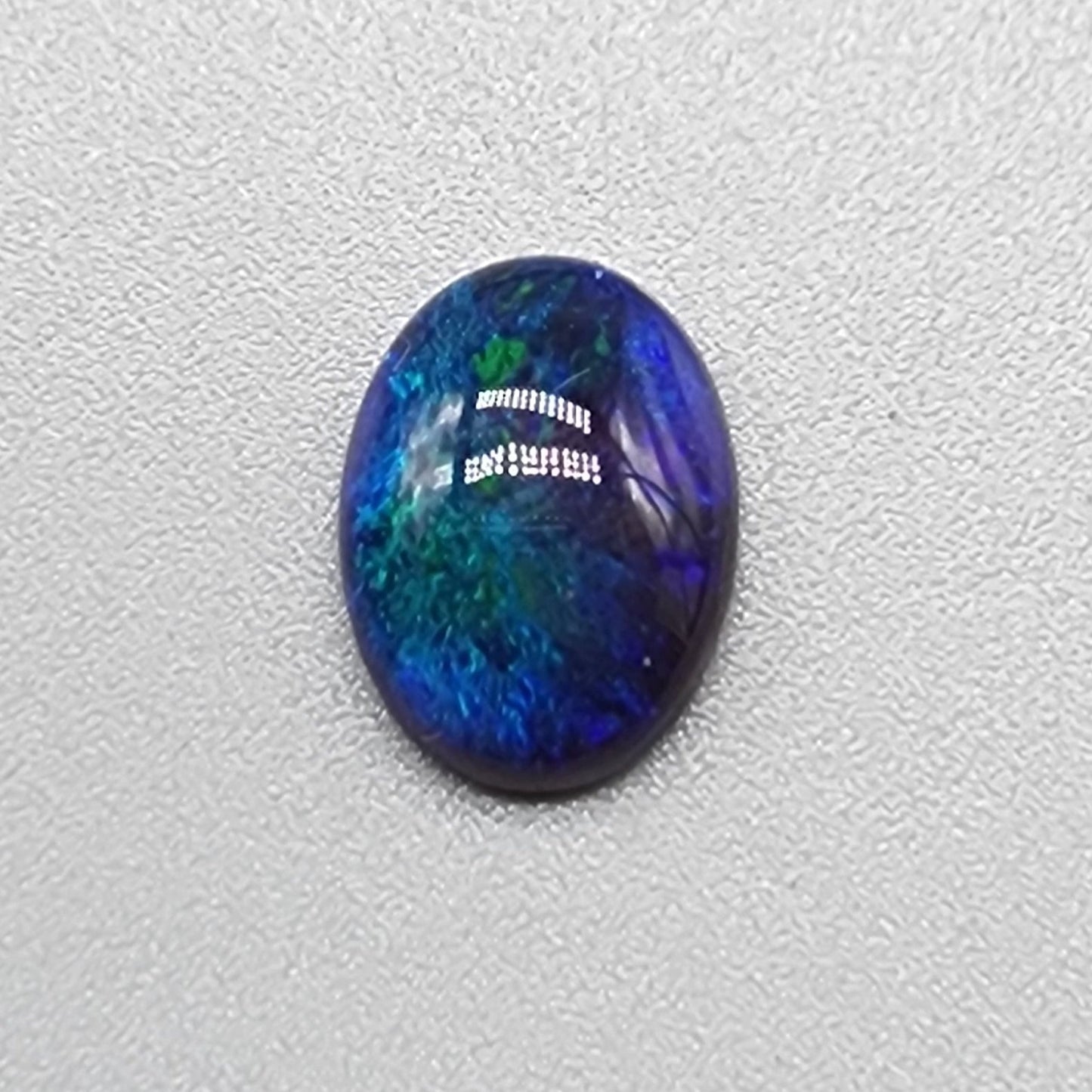 1.55cts Black Opal with small flash pattern and a galactic color scheme of blues and greens