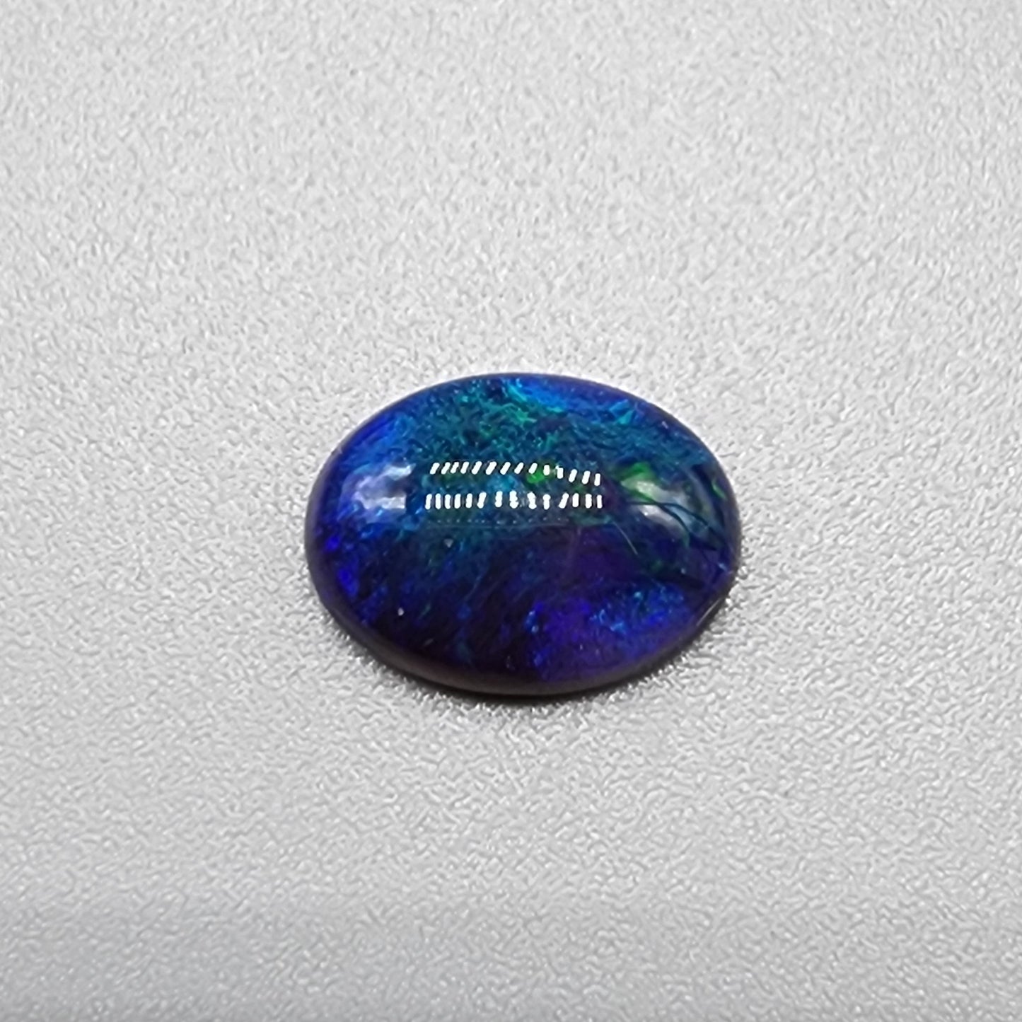 1.55cts Black Opal with small flash pattern and a galactic color scheme of blues and greens