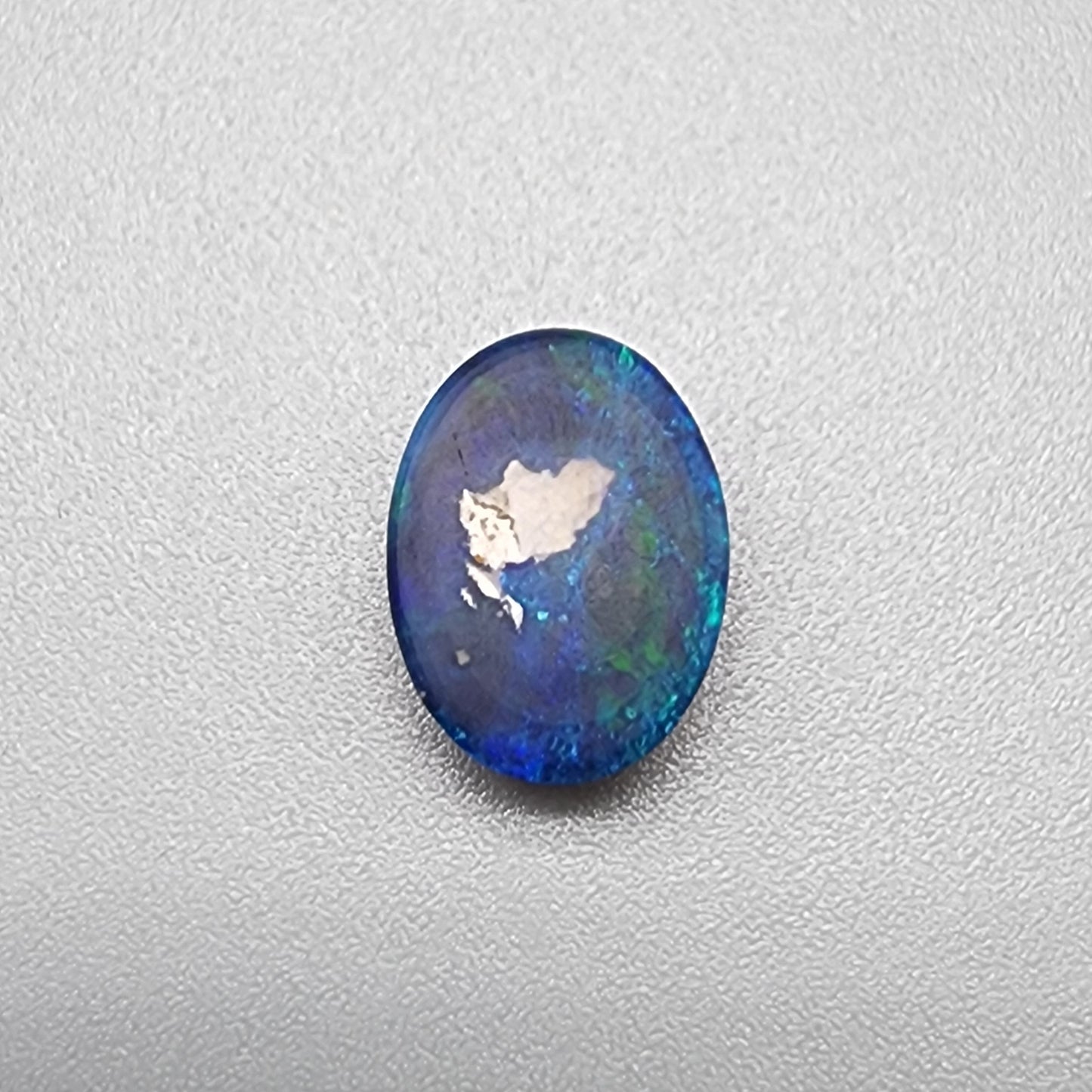 1.55cts Black Opal with small flash pattern and a galactic color scheme of blues and greens