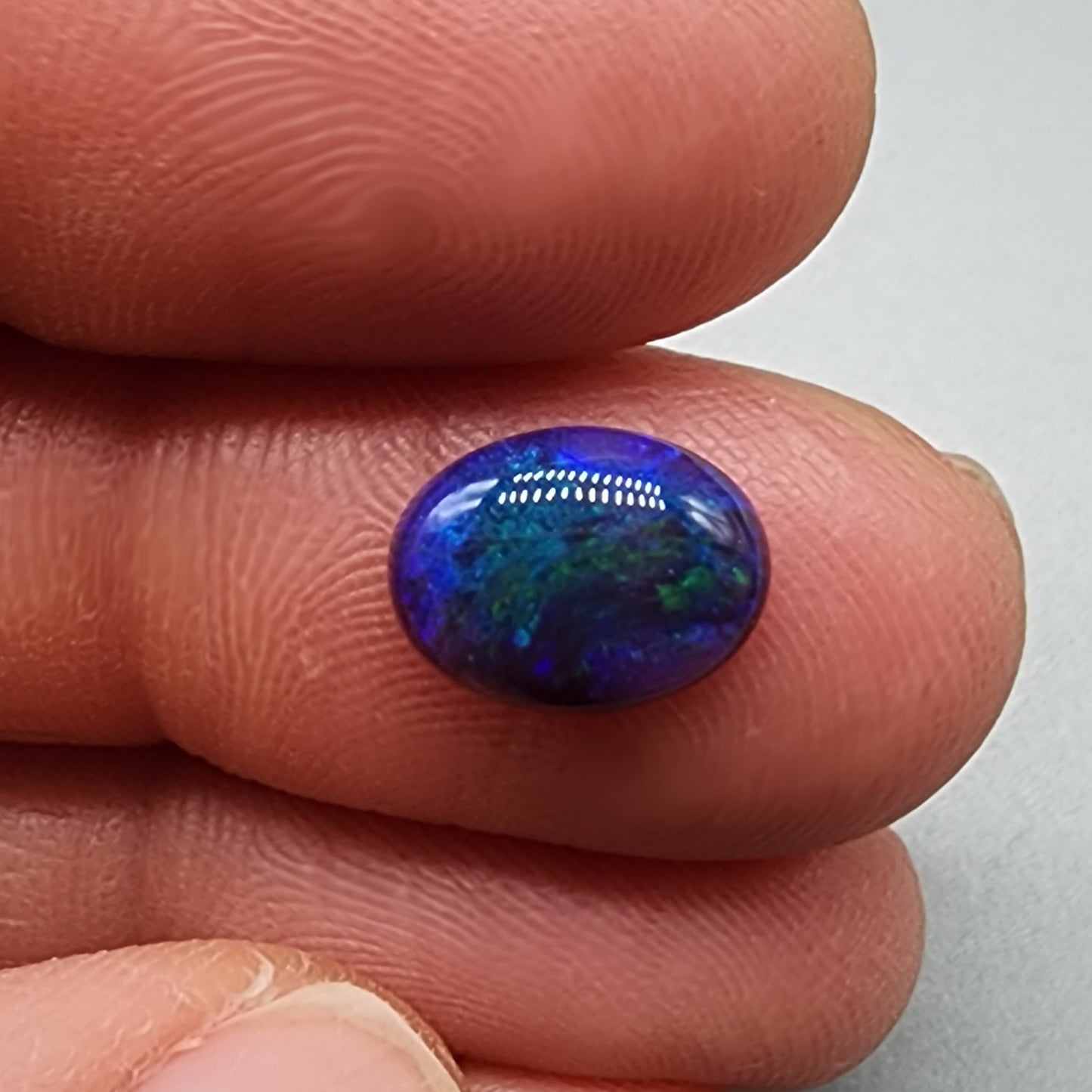 1.55cts Black Opal with small flash pattern and a galactic color scheme of blues and greens